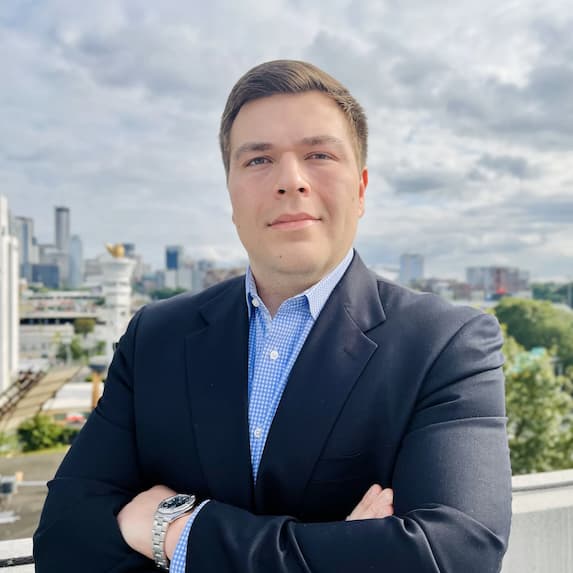 Christian E., Georgia Property Tax Consultant, headshot of a caucasian man in navy blue suit.